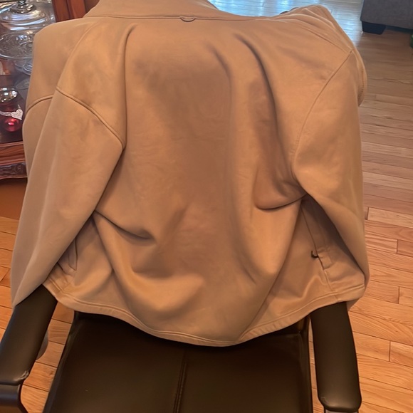 Under armor storm Jacket,, size large green exterior with a beige interior. - Picture 3 of 4